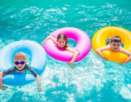 Children swimming in gulf shores beach houses with private pool