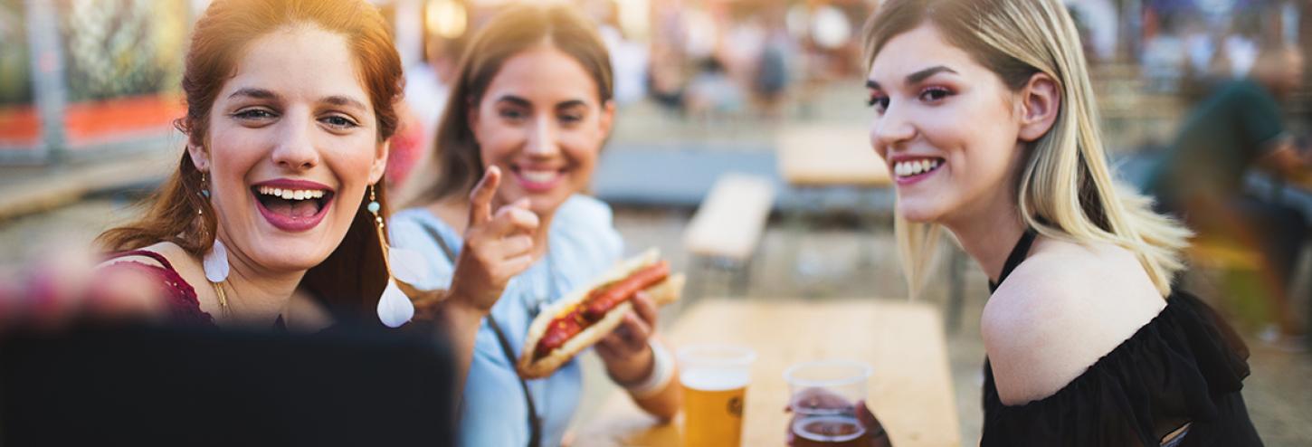 Girlfriends at a German Sausage Festival